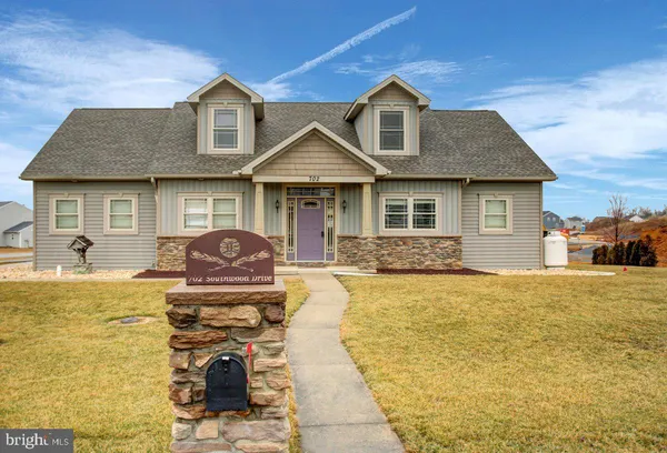 a front view of a house with swimming pool