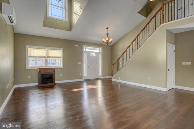a view of an entryway with wooden floor and a window