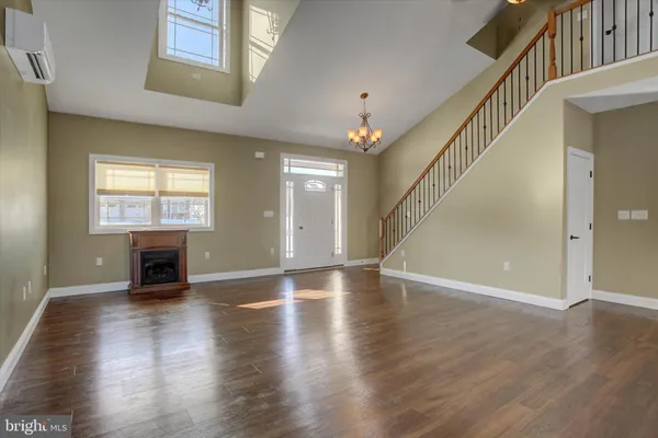 a view of an entryway with wooden floor and a window