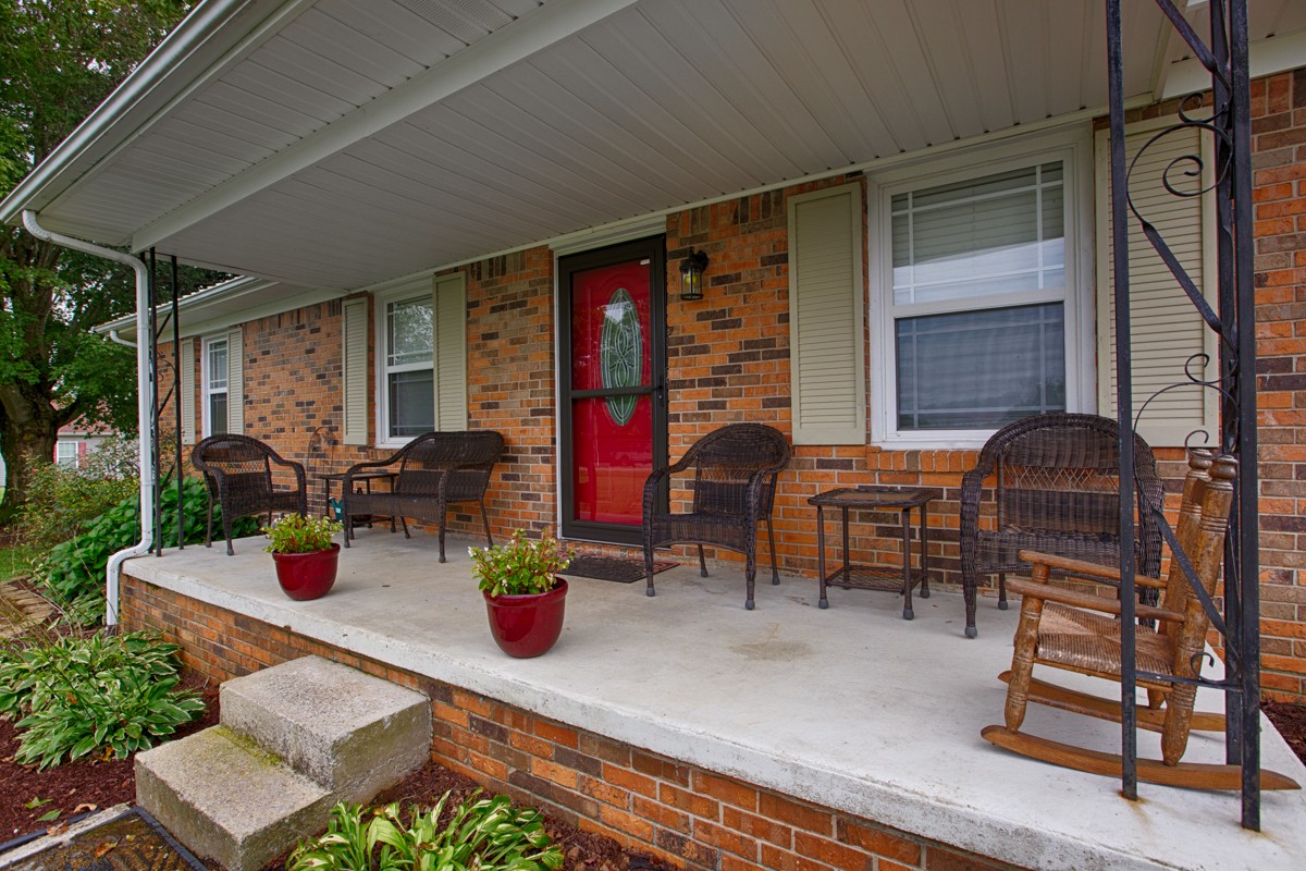 61 Slaughter Pen Road Ardmore, TN 38449 - Photo 3 of 23 a table and chairs in front of the house
