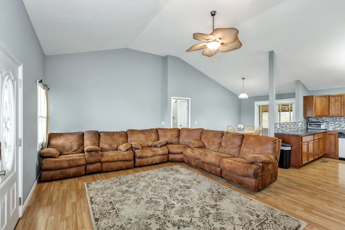61 Slaughter Pen Road Ardmore, TN 38449 - Photo 4 of 23 a living room with a couch and a chandelier
