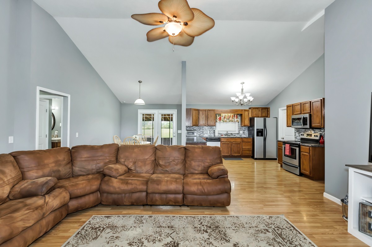 61 Slaughter Pen Road Ardmore, TN 38449 - Photo 5 of 23 a living room with furniture kitchen view and a chandelier