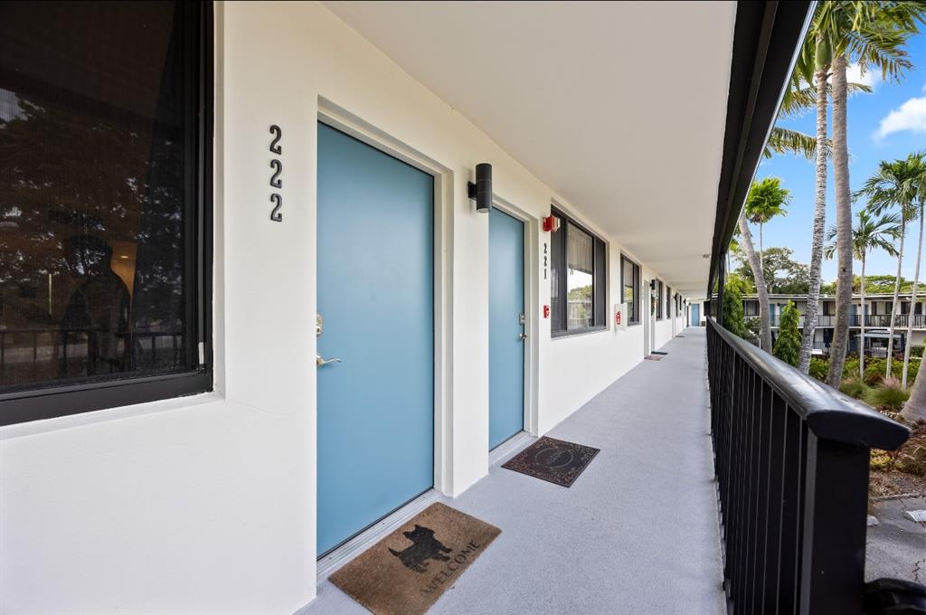 1901 North Andrews Avenue, Unit 222 Wilton Manors, FL 33311 - Photo 16 of 23 a balcony with wooden floor