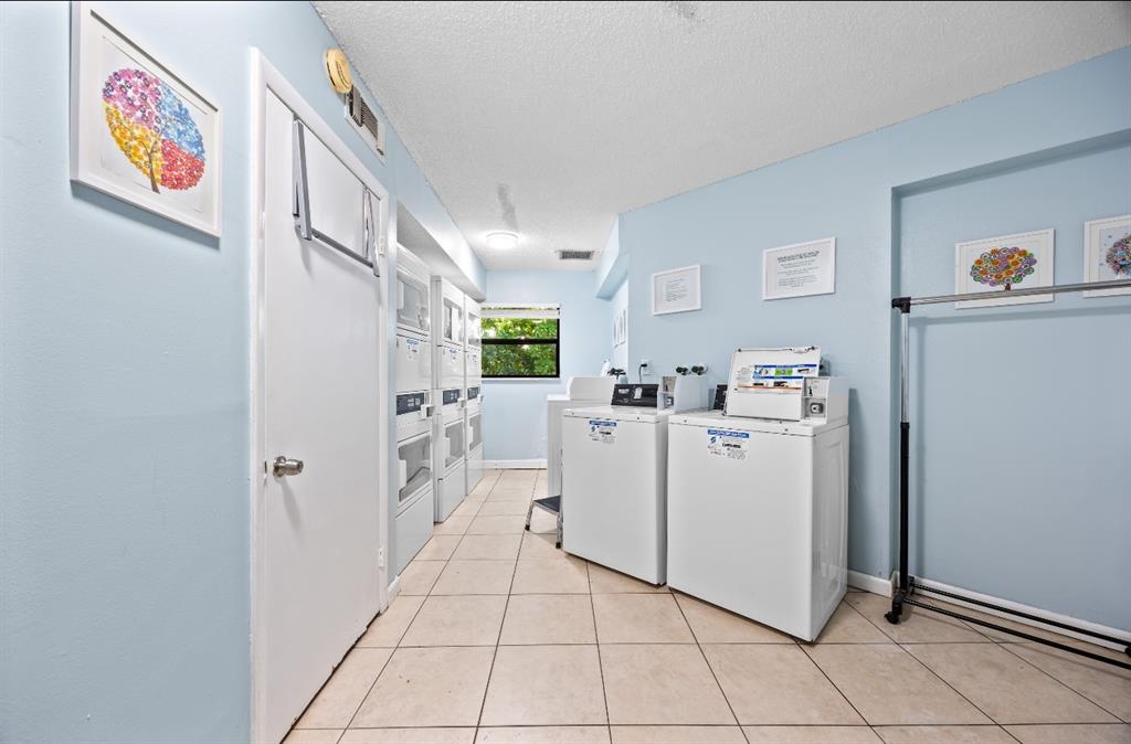 1901 North Andrews Avenue, Unit 222 Wilton Manors, FL 33311 - Photo 20 of 23 a view of utility room with washer and dryer