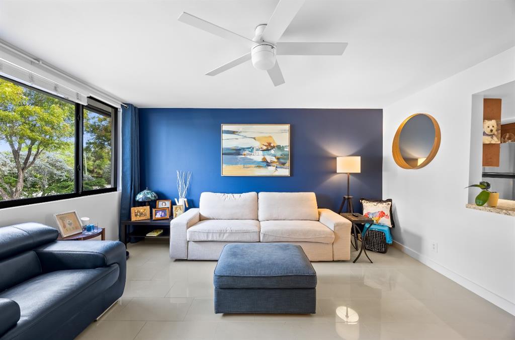1901 North Andrews Avenue, Unit 222 Wilton Manors, FL 33311 - Photo 2 of 23 a living room with furniture and a large window