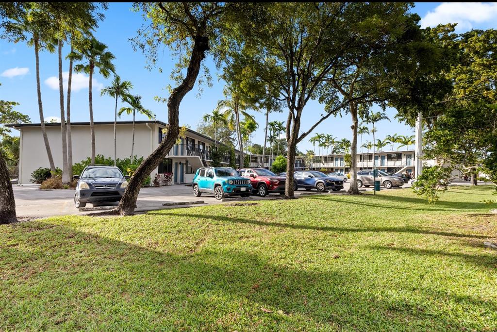 1901 North Andrews Avenue, Unit 222 Wilton Manors, FL 33311 - Photo 23 of 23 a view of park with bench and trees