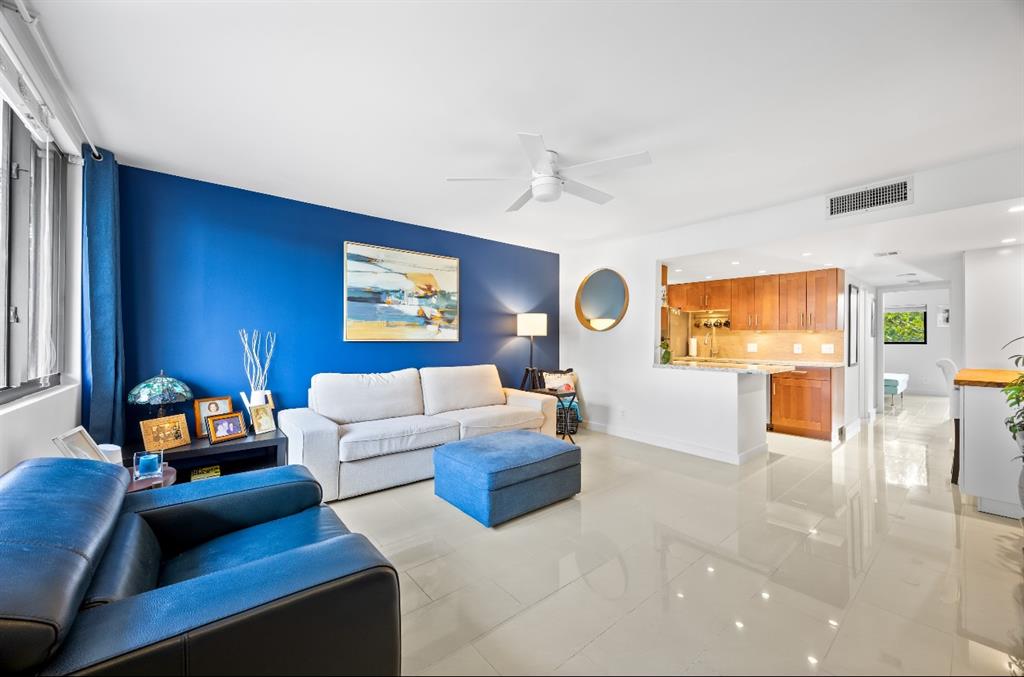 1901 North Andrews Avenue, Unit 222 Wilton Manors, FL 33311 - Photo 6 of 23 a living room with furniture and a flat screen tv