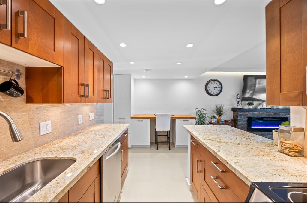 1901 North Andrews Avenue, Unit 222 Wilton Manors, FL 33311 - Photo 9 of 23 a kitchen with a sink a counter space and appliances