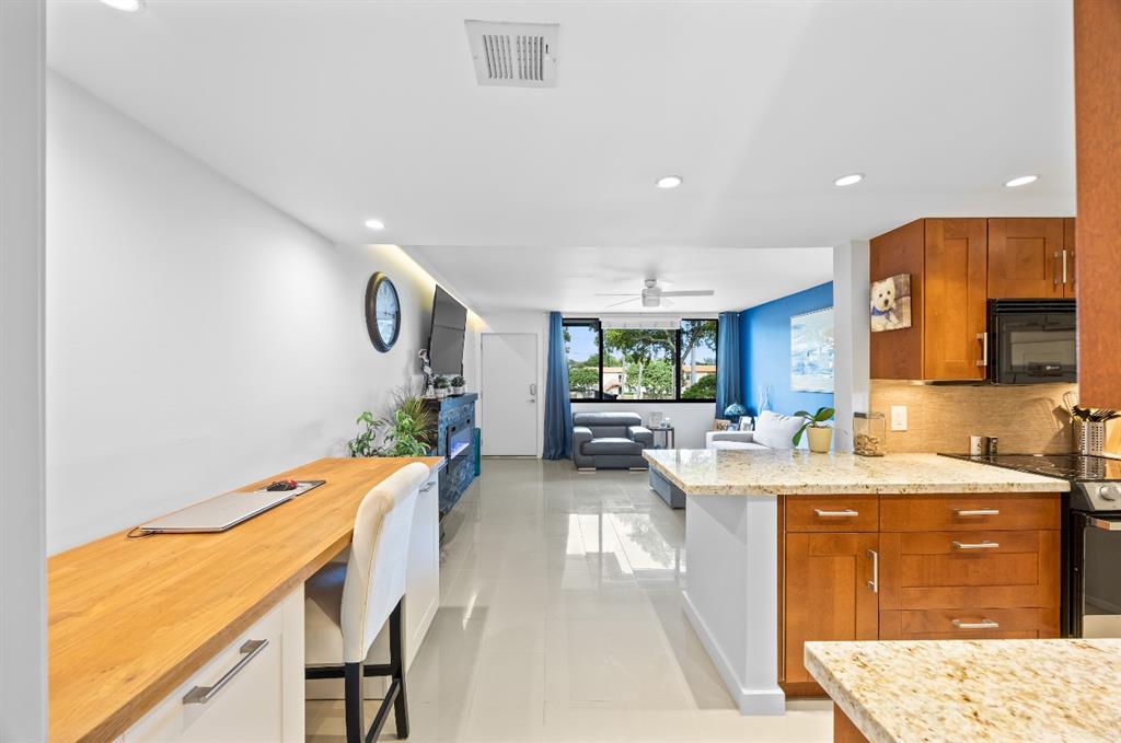 1901 North Andrews Avenue, Unit 222 Wilton Manors, FL 33311 - Photo 10 of 23 a very nice looking dining room with a large window
