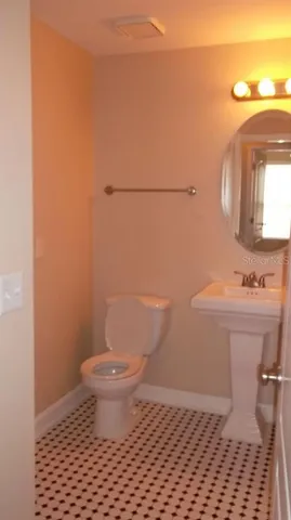 a bathroom with a toilet and a sink