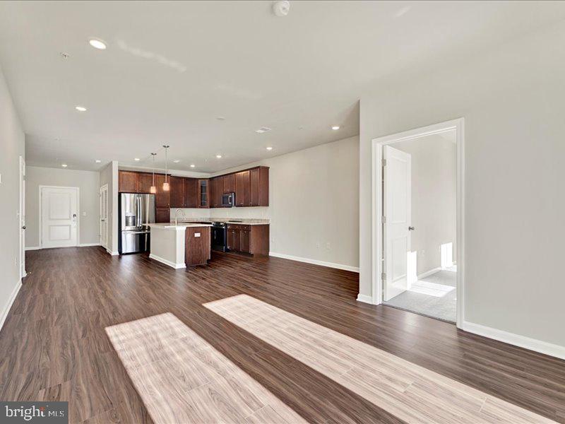 4003 Seaside Alder Road, Unit 308 ROSE Bowie, MD 20720 - Photo 19 of 44 a view of kitchen and wooden floor