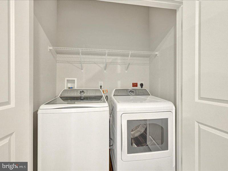 4003 Seaside Alder Road, Unit 308 ROSE Bowie, MD 20720 - Photo 27 of 44 a utility room with dryer and washer