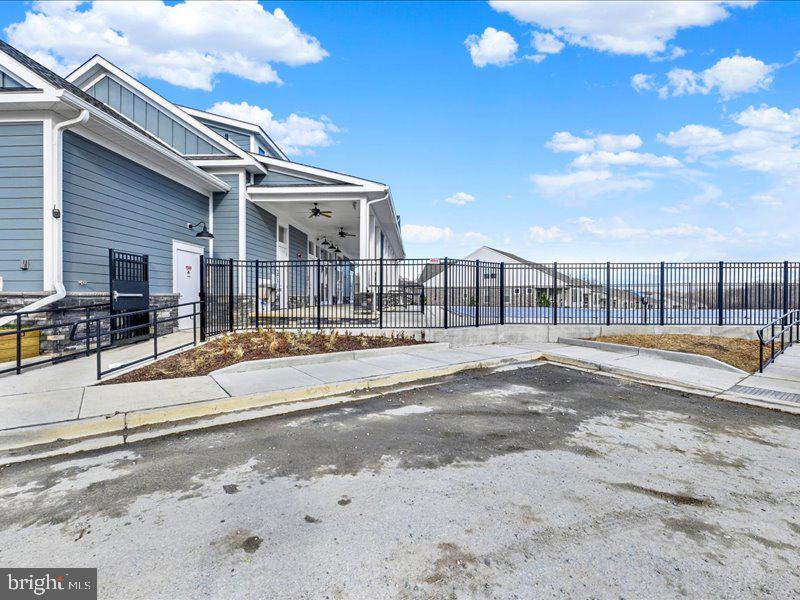 4003 Seaside Alder Road, Unit 308 ROSE Bowie, MD 20720 - Photo 41 of 44 a view of a swimming pool with a lounge chairs