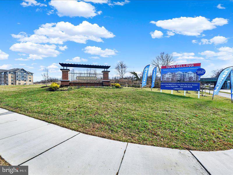 4003 Seaside Alder Road, Unit 308 ROSE Bowie, MD 20720 - Photo 42 of 44 a view of a house with a yard