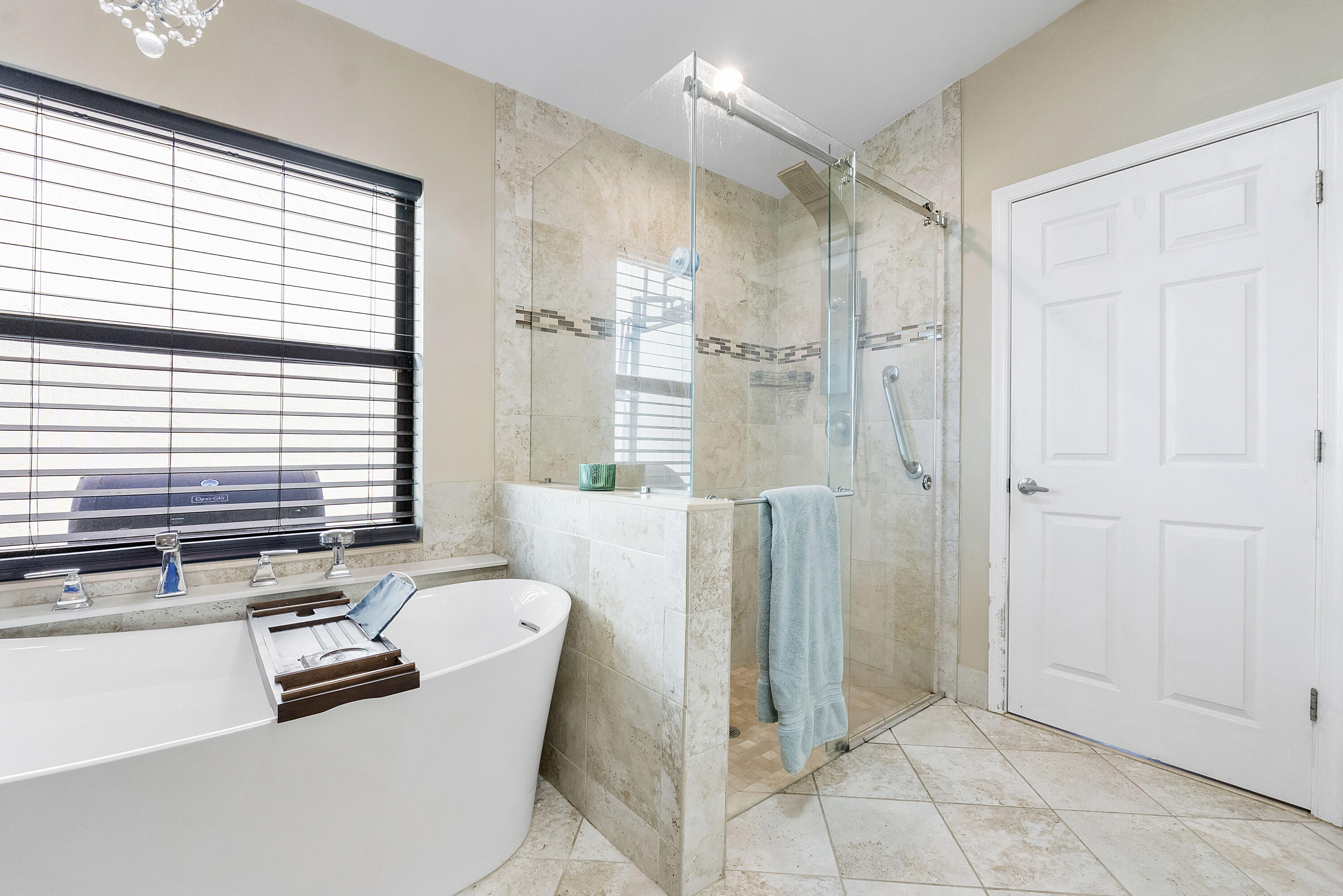 12328 St Simon Drive Boca Raton, FL 33428 - Photo 24 of 52 a bathroom with a tub shower and sink
