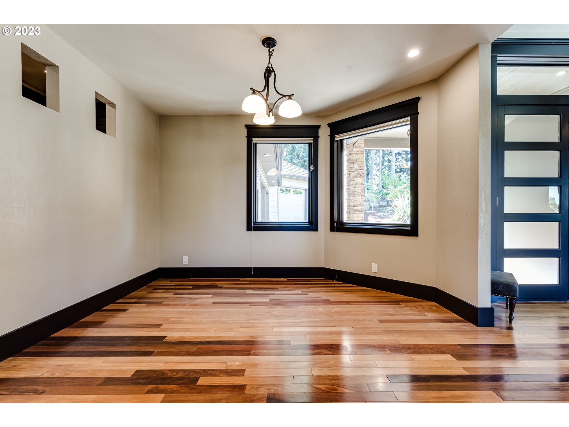 3321 Michael Lane Eugene, OR 97405 - Photo 11 of 46 a view of an empty room with window and wooden floor