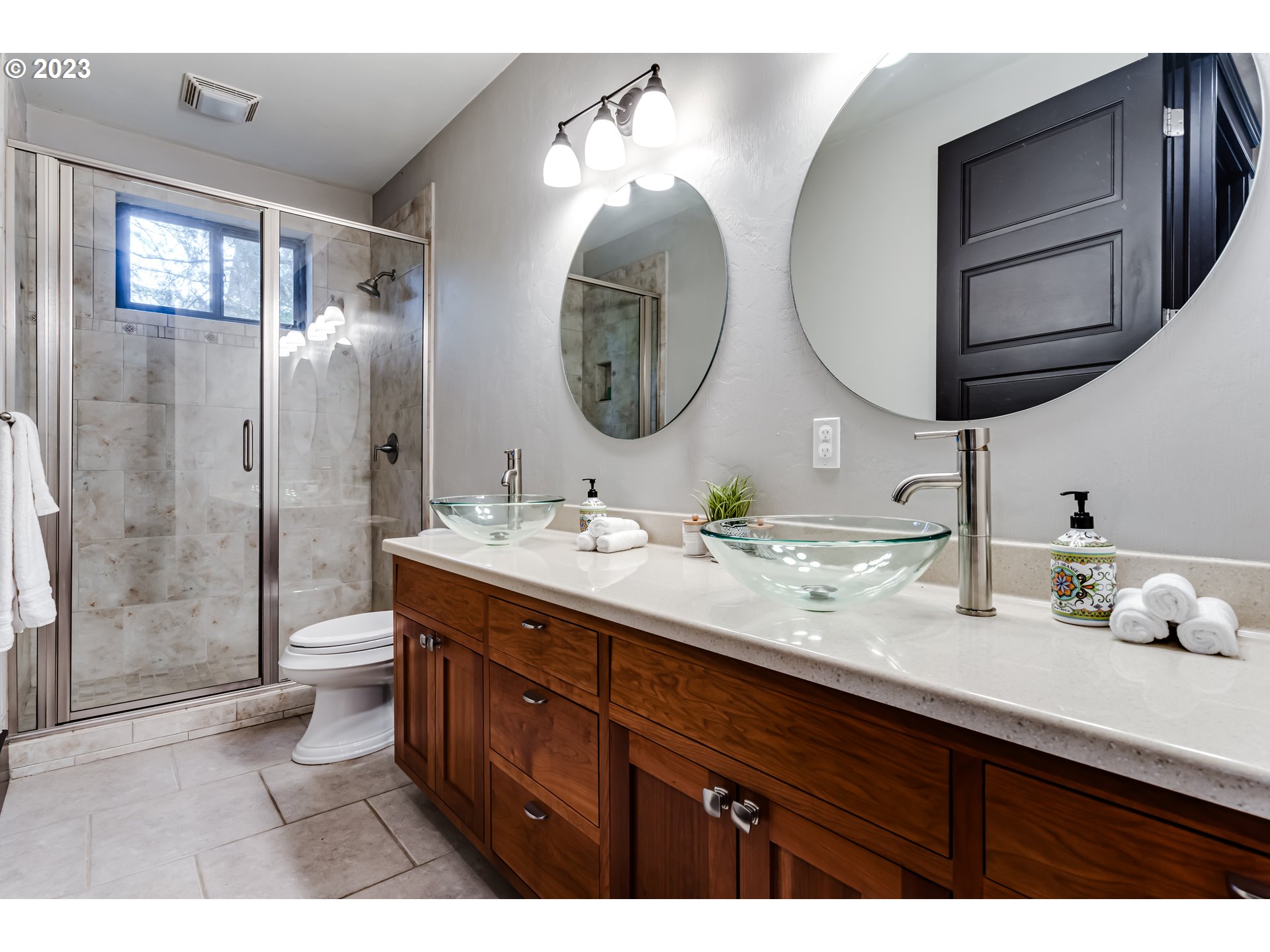 3321 Michael Lane Eugene, OR 97405 - Photo 15 of 46 a bathroom with a double vanity sink mirror and shower