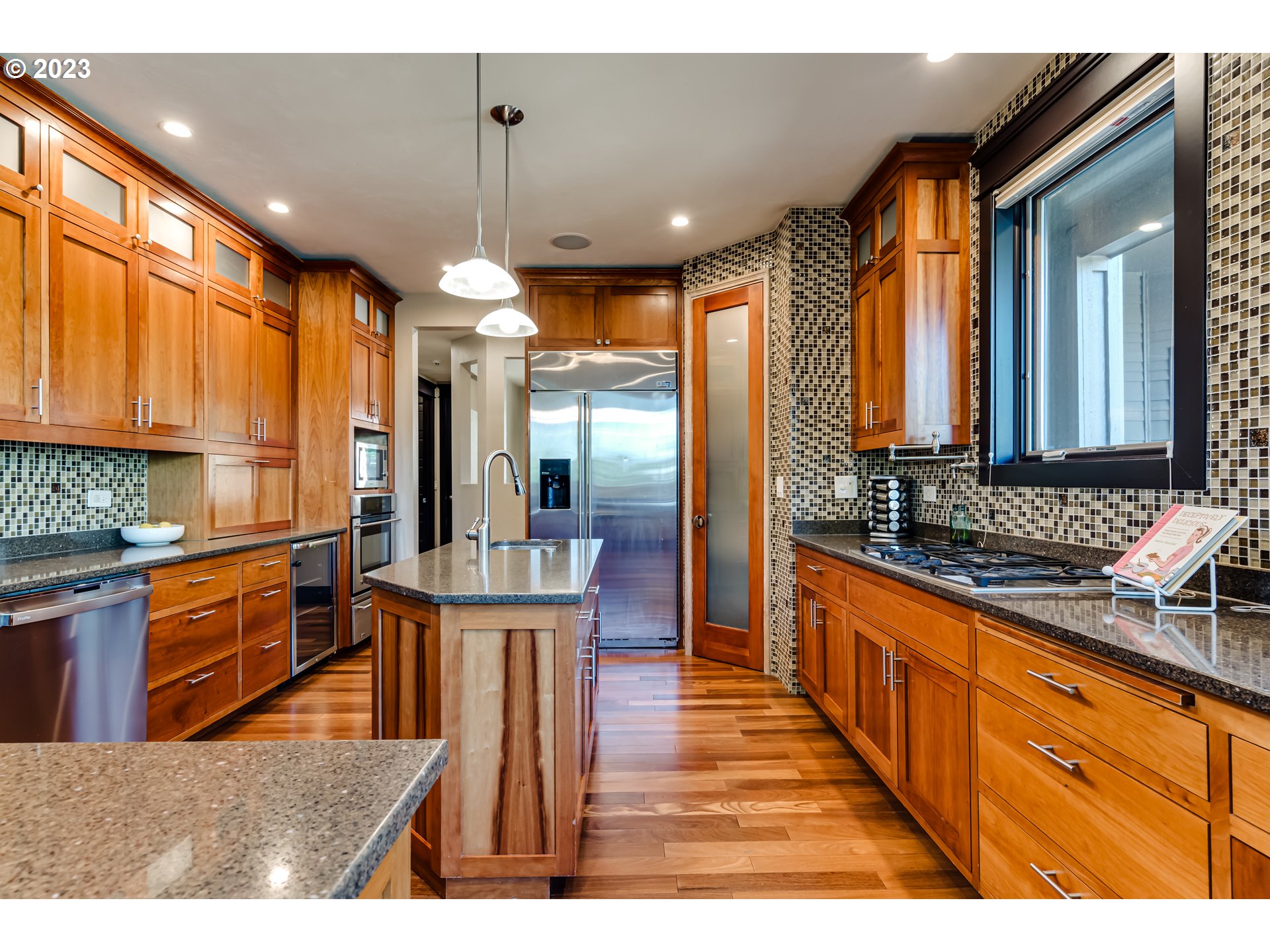 3321 Michael Lane Eugene, OR 97405 - Photo 18 of 46 a kitchen with stainless steel appliances granite countertop sink stove refrigerator and cabinets