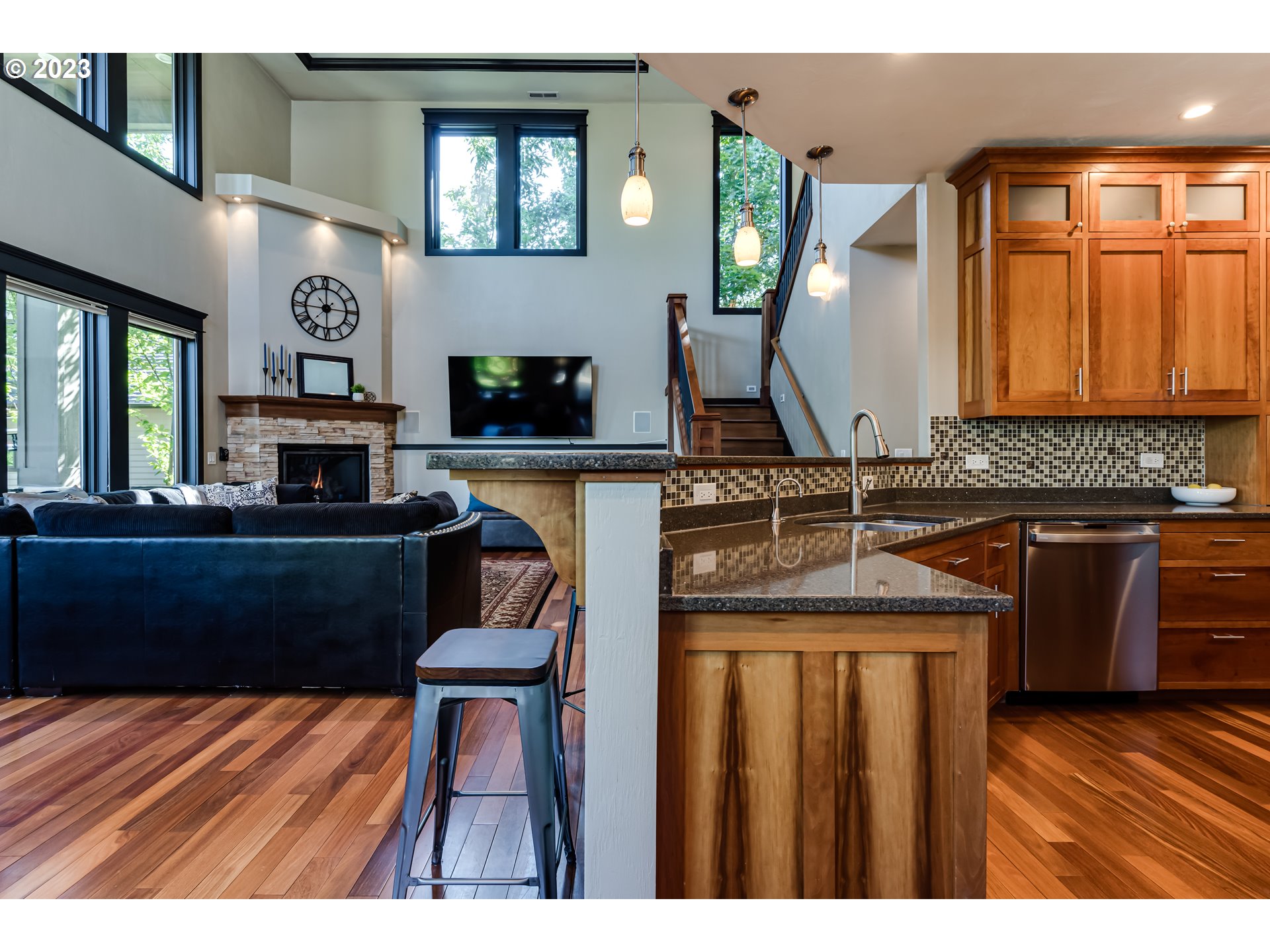 3321 Michael Lane Eugene, OR 97405 - Photo 19 of 46 a kitchen with stainless steel appliances granite countertop a sink stove and wooden cabinets
