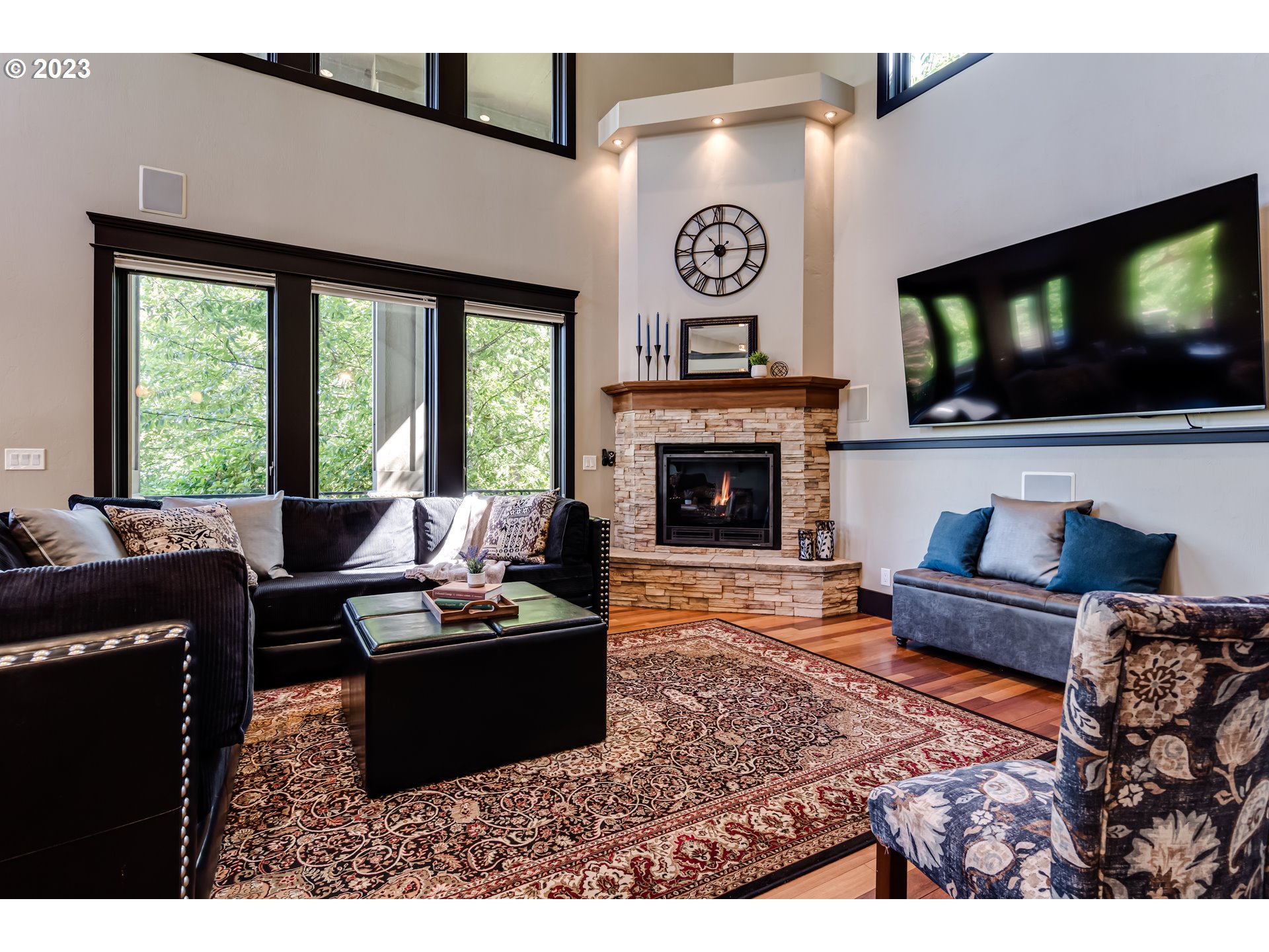 3321 Michael Lane Eugene, OR 97405 - Photo 22 of 46 a living room with furniture a flat screen tv and a fireplace