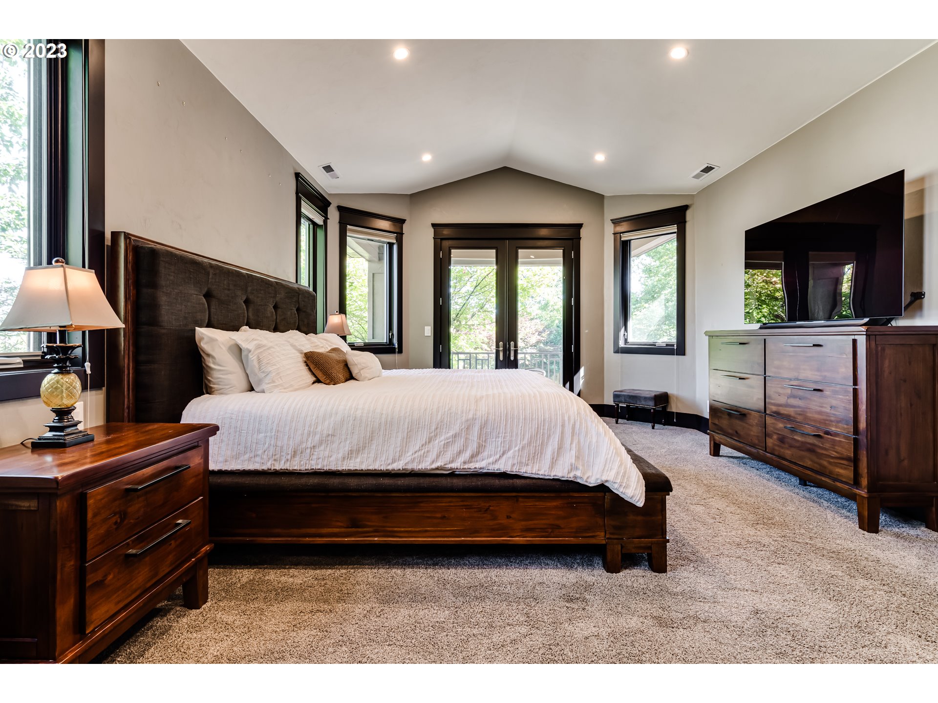 3321 Michael Lane Eugene, OR 97405 - Photo 6 of 46 a spacious bedroom with a bed and a flat screen tv