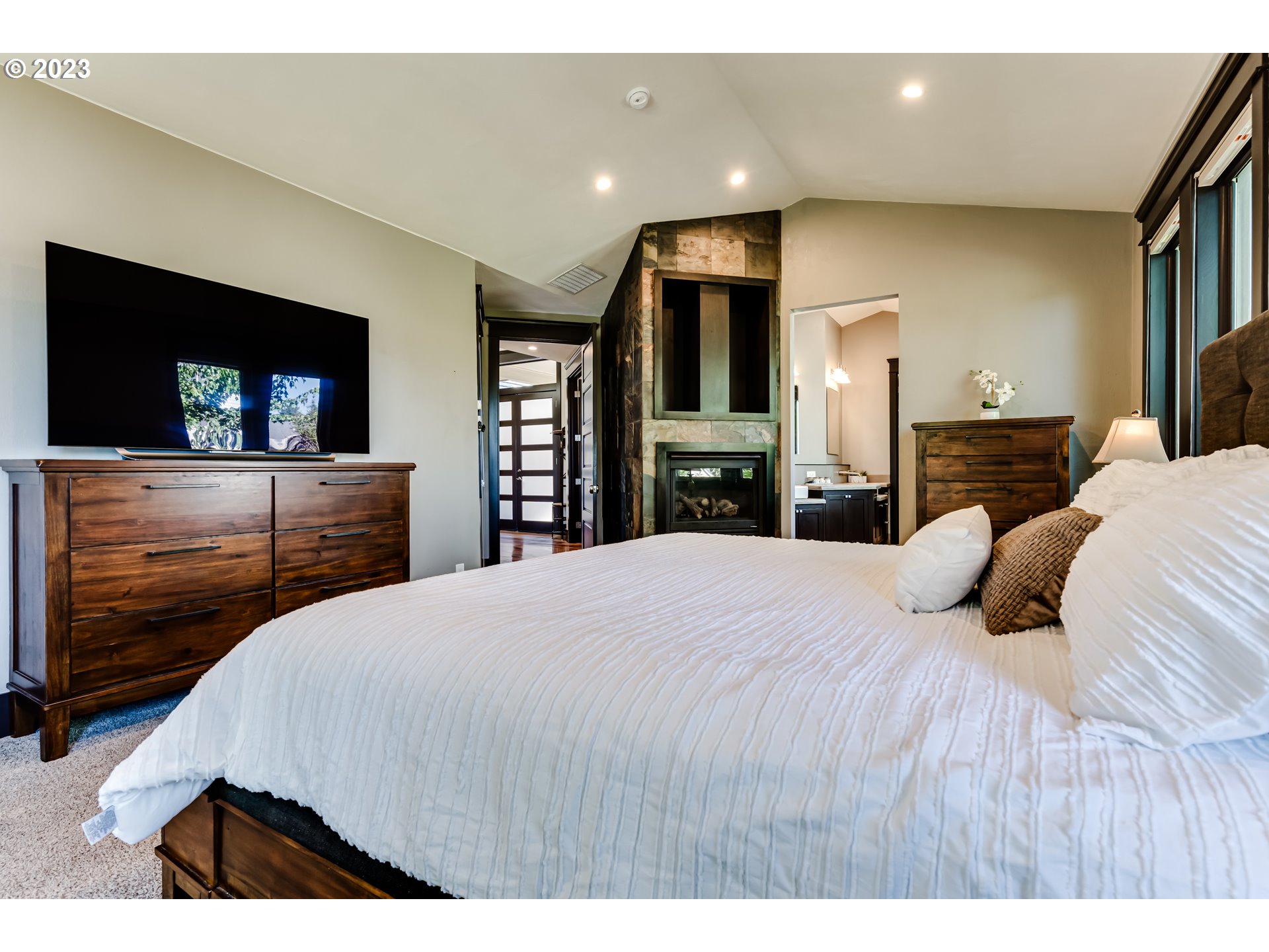 3321 Michael Lane Eugene, OR 97405 - Photo 7 of 46 a bedroom with a bed and a flat screen tv