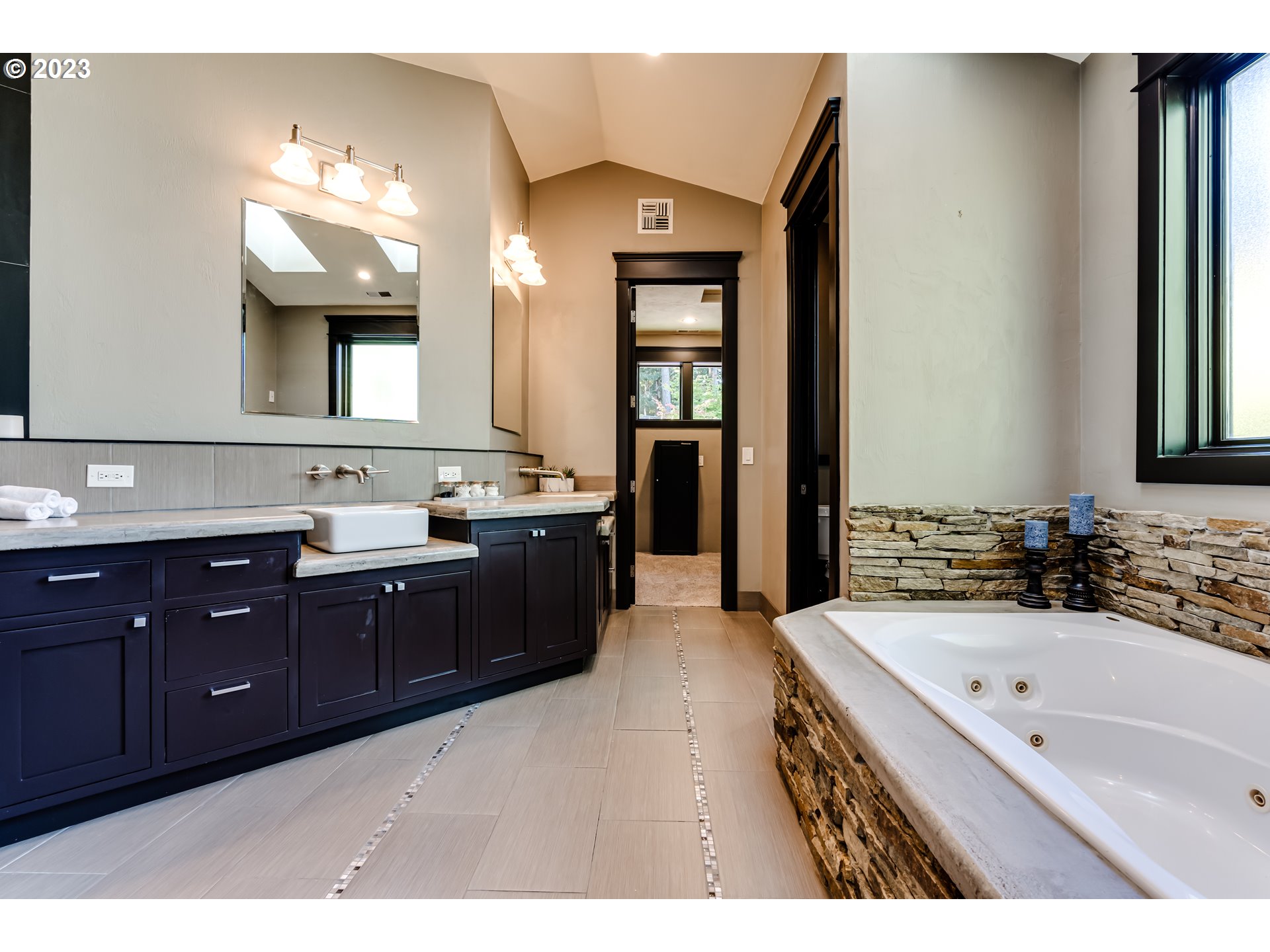 3321 Michael Lane Eugene, OR 97405 - Photo 8 of 46 a spacious bathroom with a tub sink and mirror