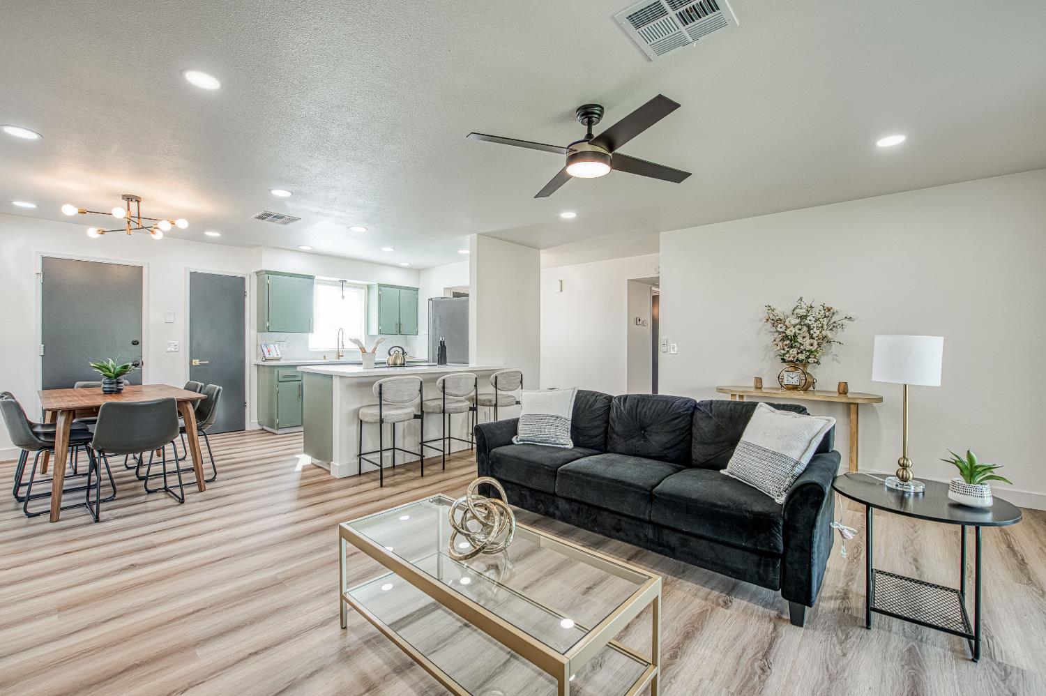 1747 Gettysburg Avenue Clovis, CA 93611 - Photo 2 of 39 a living room with furniture and a view of kitchen