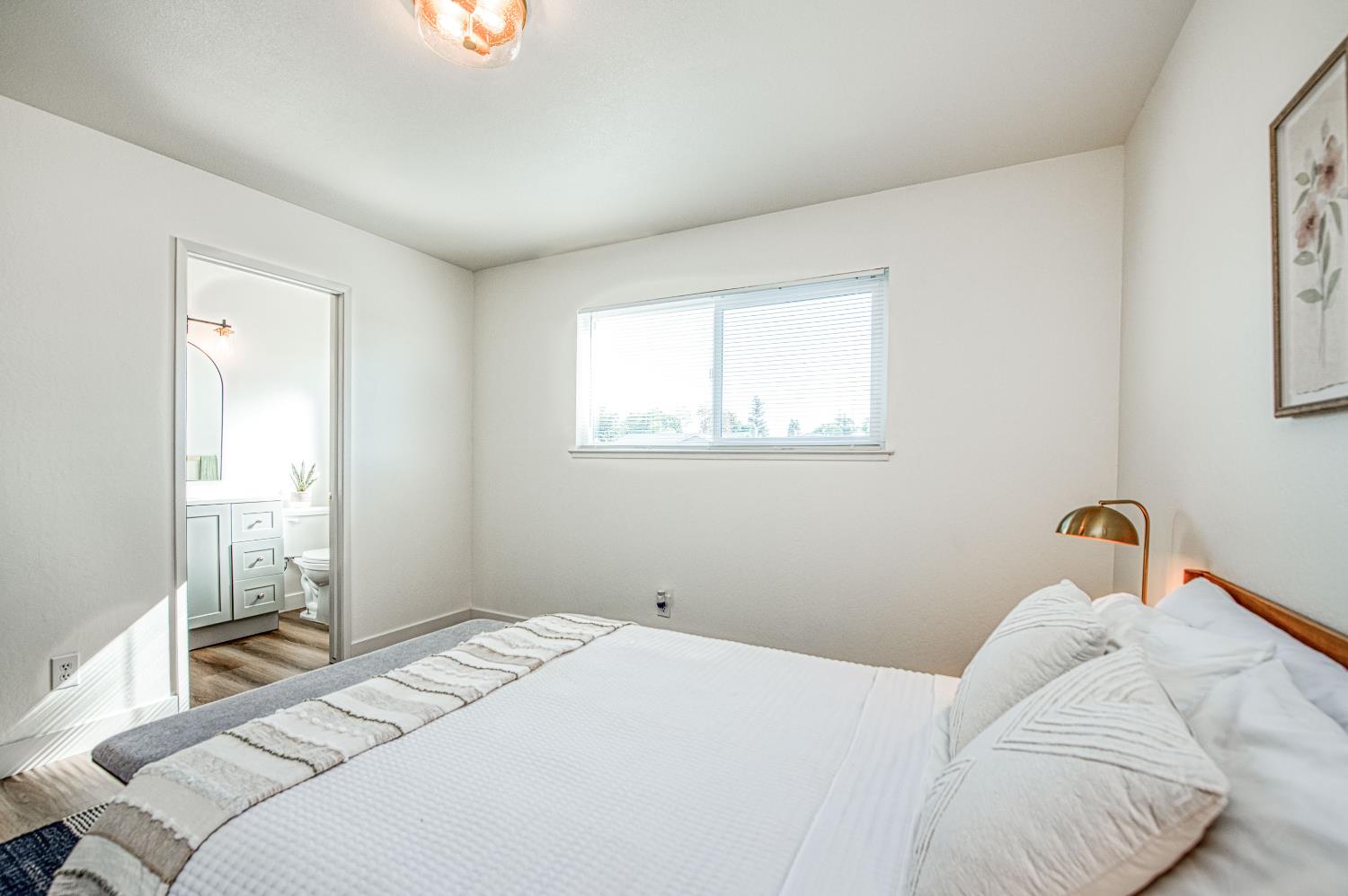 1747 Gettysburg Avenue Clovis, CA 93611 - Photo 26 of 39 a bedroom with a bed and a window