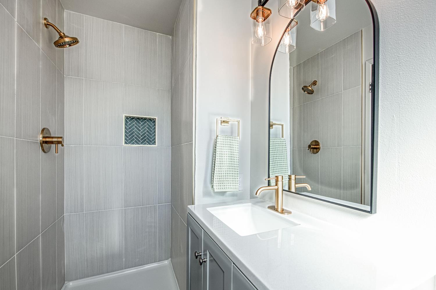 1747 Gettysburg Avenue Clovis, CA 93611 - Photo 4 of 39 a bathroom with a sink a vanity and shower