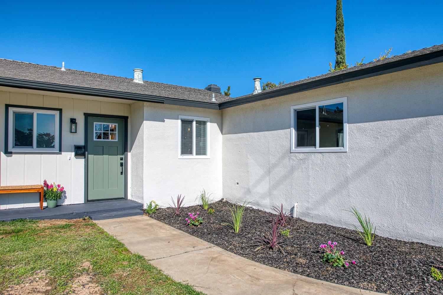1747 Gettysburg Avenue Clovis, CA 93611 - Photo 5 of 39 a front view of a house with entryway