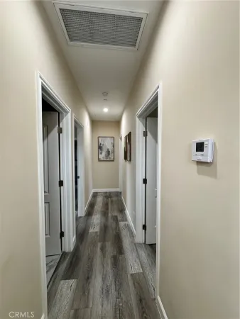 a view of room with window and wooden floor