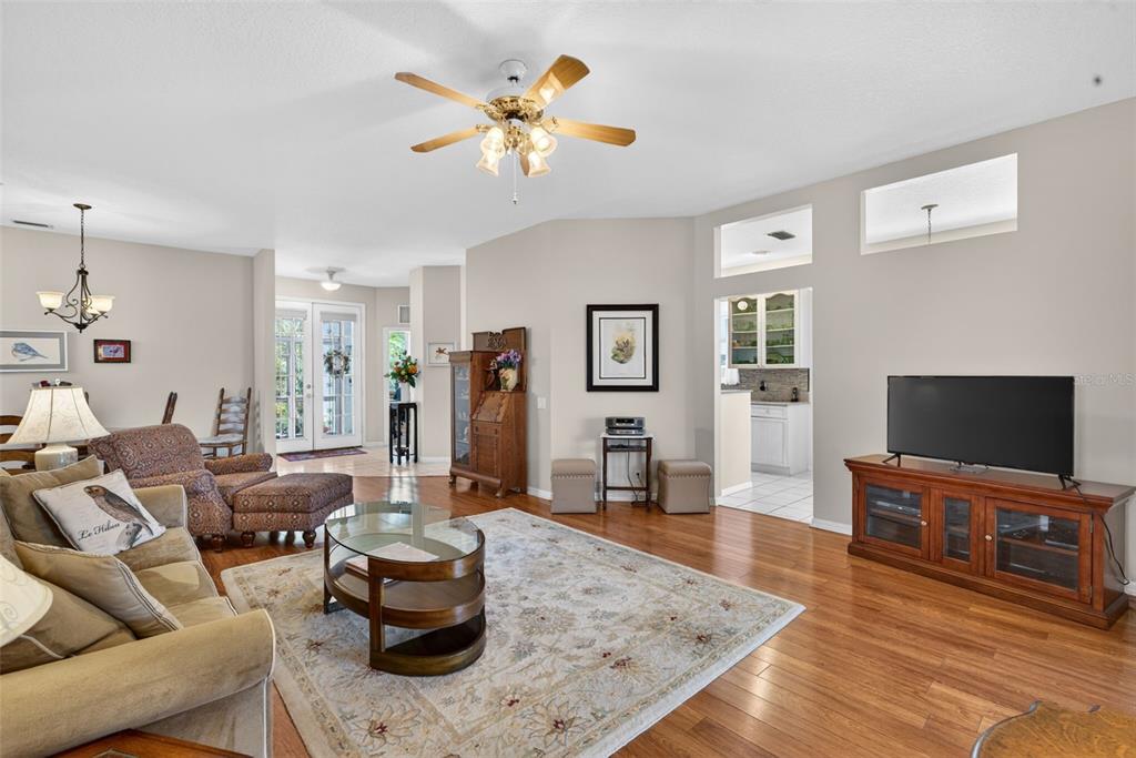 4266 Summertree Road Venice, FL 34293 - Photo 12 of 64 a living room with furniture and a flat screen tv