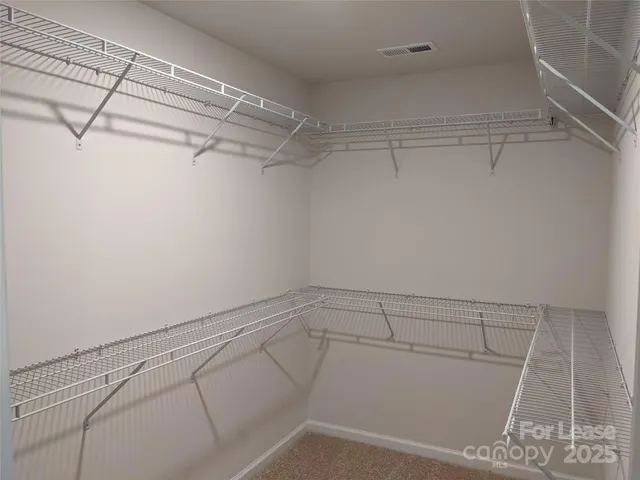 a view of a room with racks on the wall