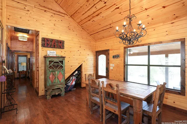 a view of a livingroom with furniture window and wooden floor