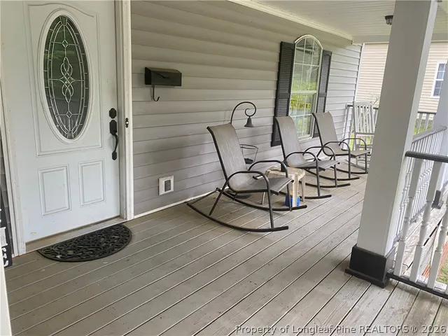 a view of a livingroom with furniture and front door