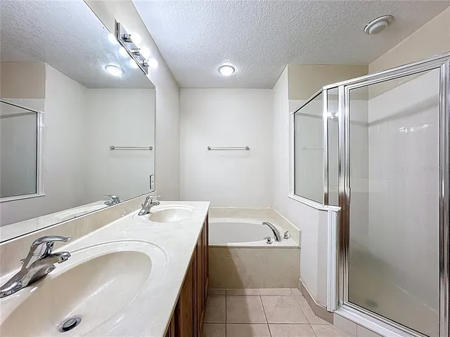 a bathroom with a bathtub and a sink
