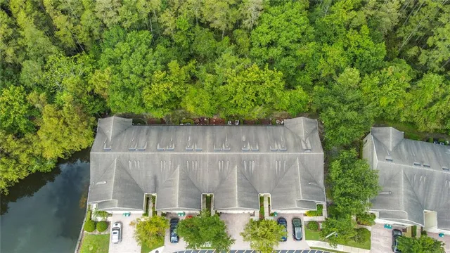 an aerial view of a house with a backyard space