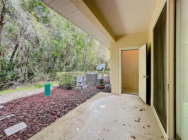 a backyard of a house with barbeque oven