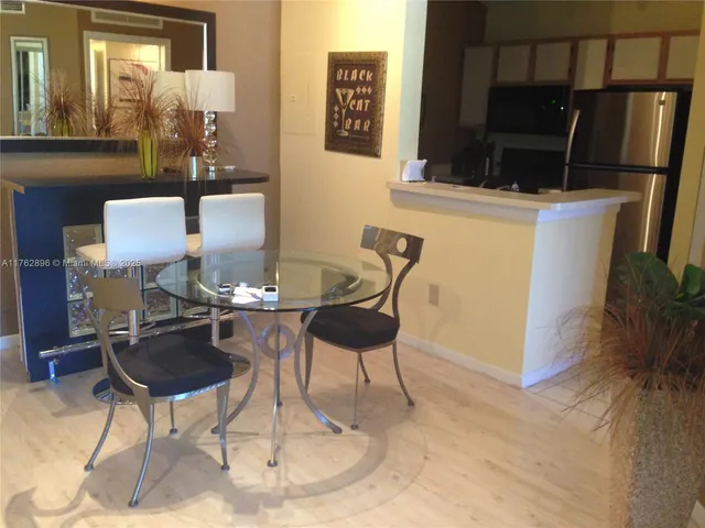 a view of a dining room with furniture