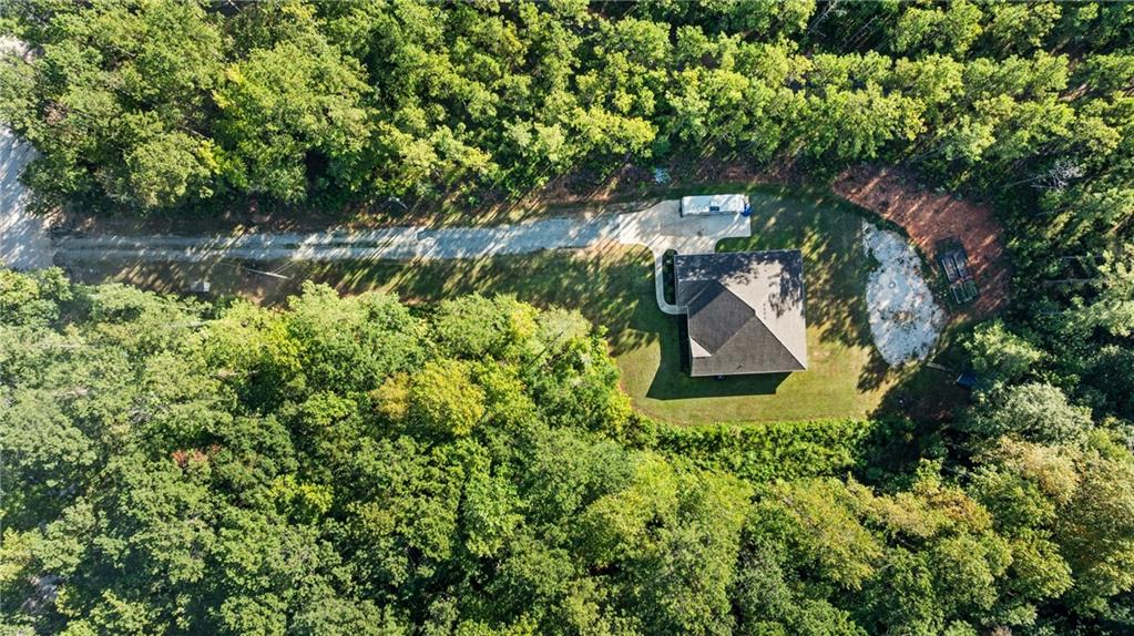 3696 Lee Road Salem, AL 36874 - Photo 4 of 36 Aerial view showcasing a contemporary residence nestled within mature, densely forested grounds