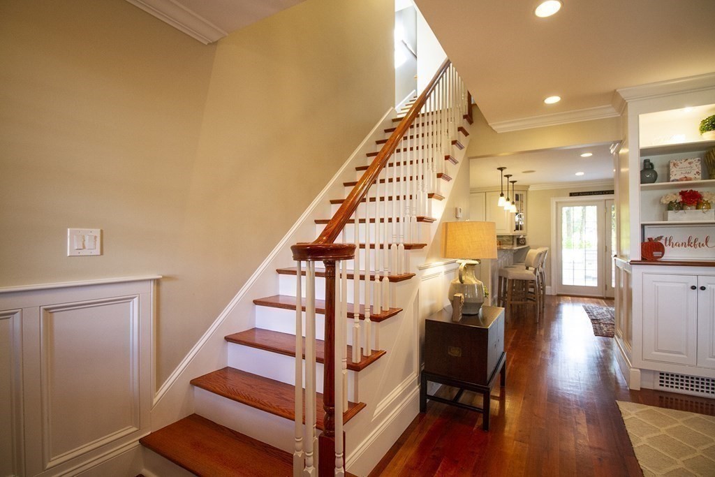 41-43 Stone Street Walpole, MA 02081 - Photo 11 of 36 a view of entryway and hall with wooden floor