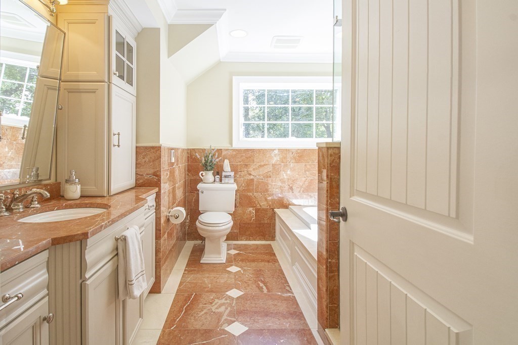41-43 Stone Street Walpole, MA 02081 - Photo 12 of 36 a spacious bathroom with a granite countertop sink a toilet and a shower