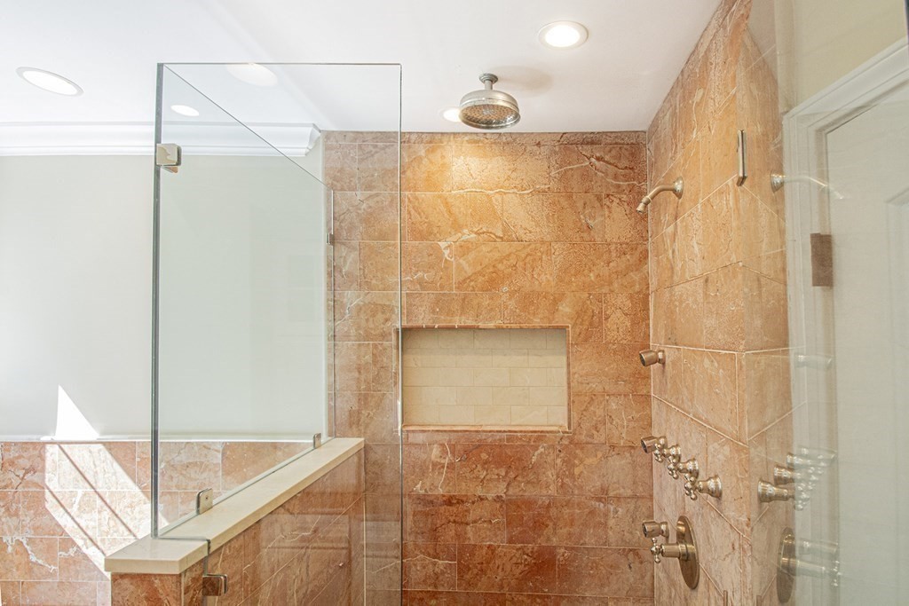 41-43 Stone Street Walpole, MA 02081 - Photo 13 of 36 a bathroom with a shower and a glass door