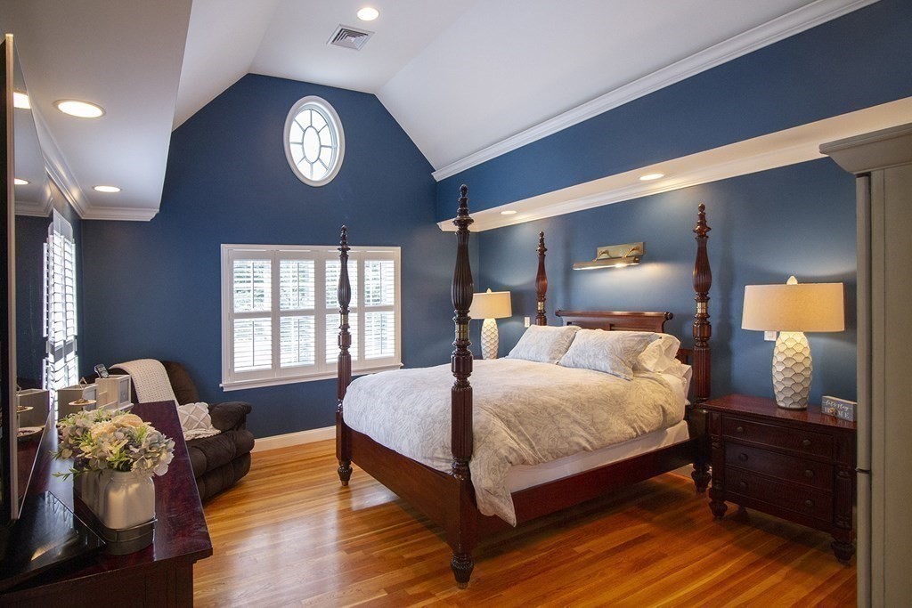 41-43 Stone Street Walpole, MA 02081 - Photo 14 of 36 a bedroom with a bed and wooden floor