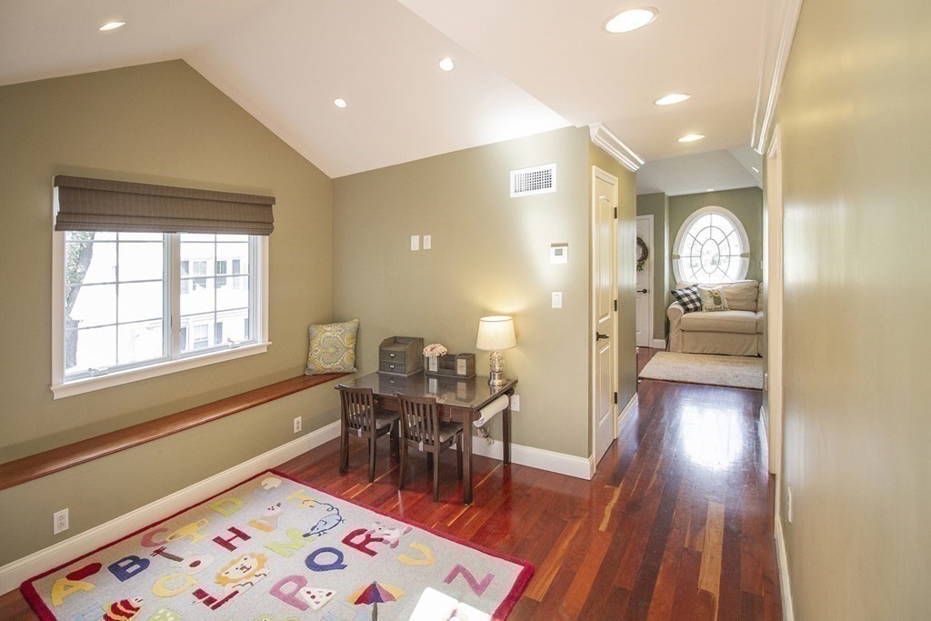 41-43 Stone Street Walpole, MA 02081 - Photo 19 of 36 a view of a livingroom with furniture wooden floor and a window