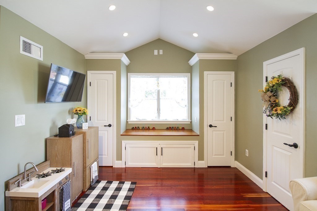 41-43 Stone Street Walpole, MA 02081 - Photo 21 of 36 a view of a hallway with wooden floor and windows