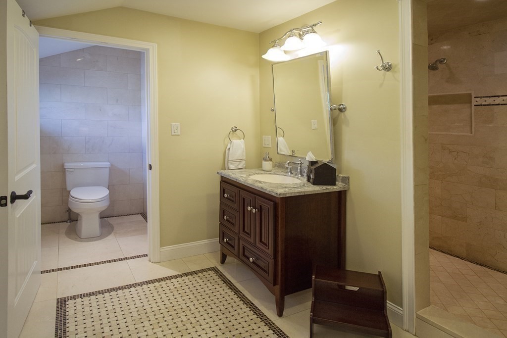 41-43 Stone Street Walpole, MA 02081 - Photo 22 of 36 a bathroom with a sink a toilet and shower