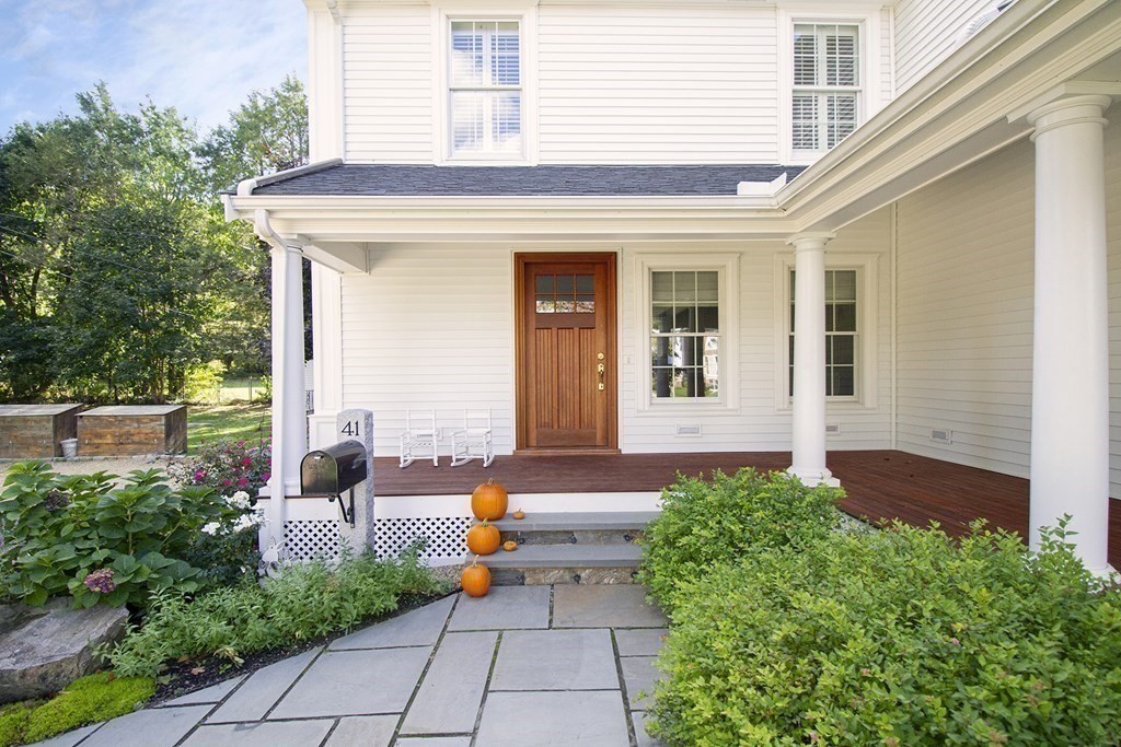 41-43 Stone Street Walpole, MA 02081 - Photo 26 of 36 a front view of a house with garden
