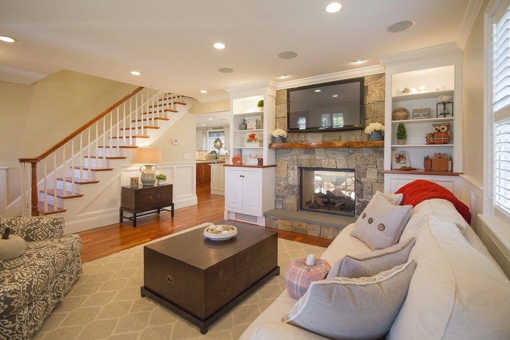 41-43 Stone Street Walpole, MA 02081 - Photo 5 of 36 a living room with furniture and a fireplace